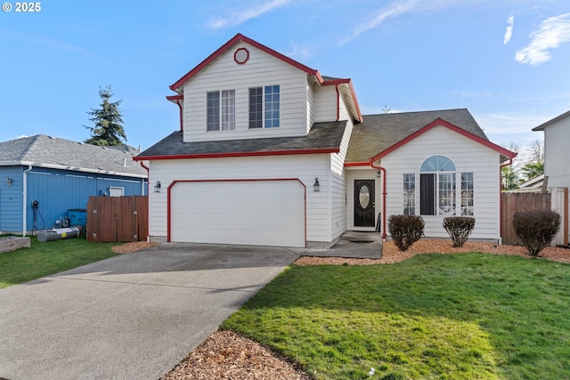 traditional-style house featuring a garage, concrete driveway, fence, and a front lawn