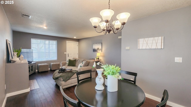 15340 SW Lexington Ln, Beaverton, OR 97007 - dining space with a chandelier, baseboards, hardwood / wood-style flooring, and a textured ceiling