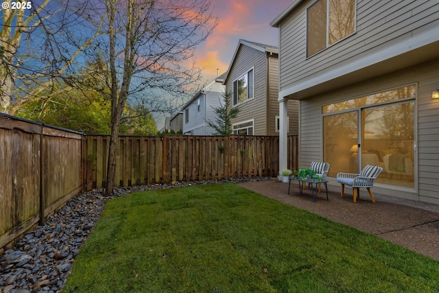 view of yard at dusk