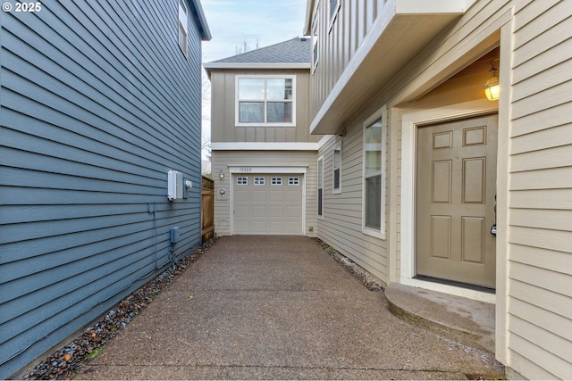 doorway to property featuring a garage