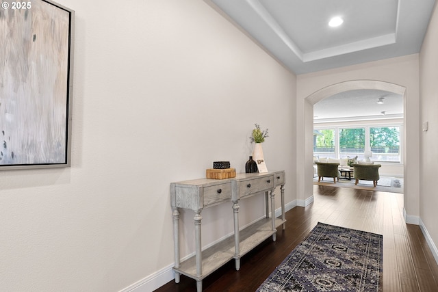 14609 NE 112th St, Vancouver, WA 98682 - hall with arched walkways, dark wood finished floors, baseboards, a tray ceiling, and recessed lighting