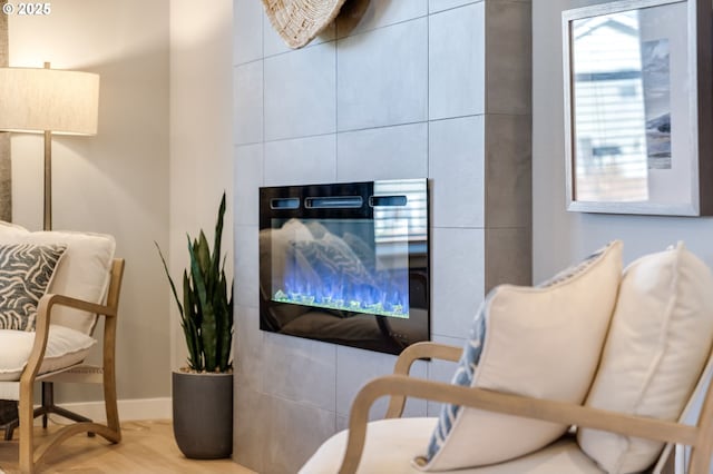 living area featuring wood finished floors and baseboards