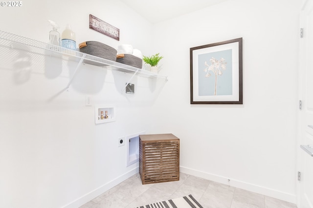 laundry room featuring laundry area, hookup for a washing machine, electric dryer hookup, and baseboards