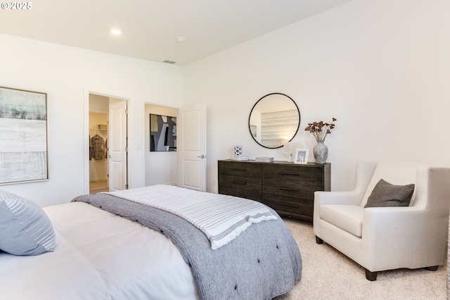 bedroom featuring light carpet, lofted ceiling, visible vents, and recessed lighting