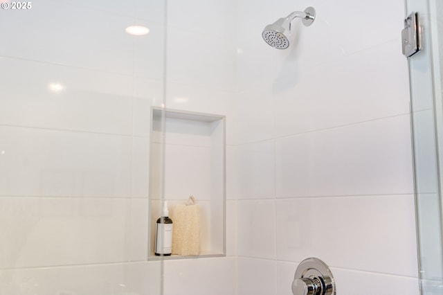 bathroom with a tile shower