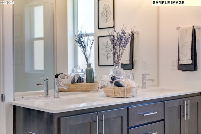 bathroom with double vanity and a sink