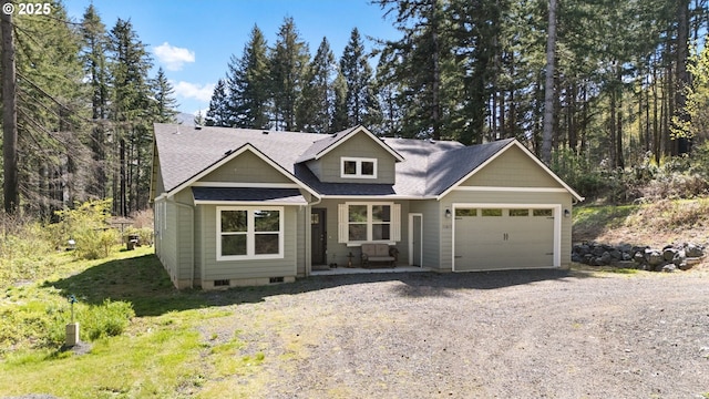craftsman inspired home featuring an attached garage, crawl space, driveway, and roof with shingles