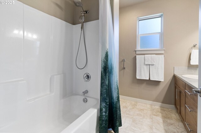 bathroom featuring baseboards, vanity, marble finish floor, and shower / bathtub combination with curtain