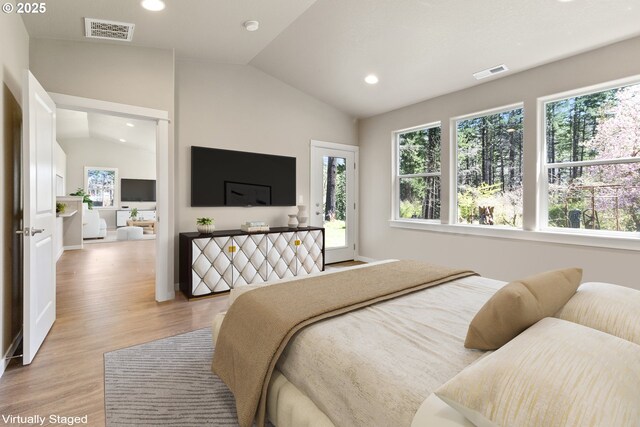 51013 Mckenzie Hwy, Vida, OR 97488 - bedroom featuring lofted ceiling, multiple windows, light wood-style flooring, recessed lighting, and baseboards
