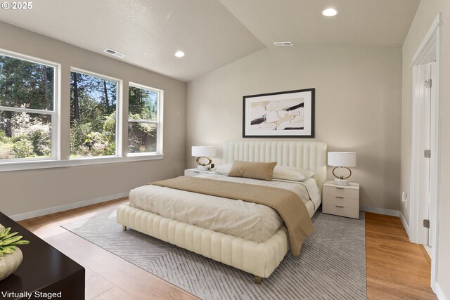 51013 Mckenzie Hwy, Vida, OR 97488 - bedroom featuring vaulted ceiling, baseboards, light wood-style flooring, and recessed lighting