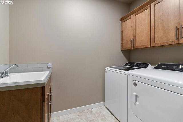 51013 Mckenzie Hwy, Vida, OR 97488 - washroom with cabinet space, independent washer and dryer, baseboards, and light marble finish floors