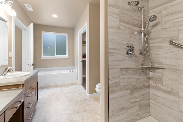 full bathroom with a tile shower, a garden tub, vanity, and visible vents