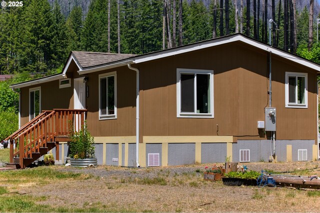51013 Mckenzie Hwy, Vida, OR 97488 - view of home's exterior featuring a wooded view