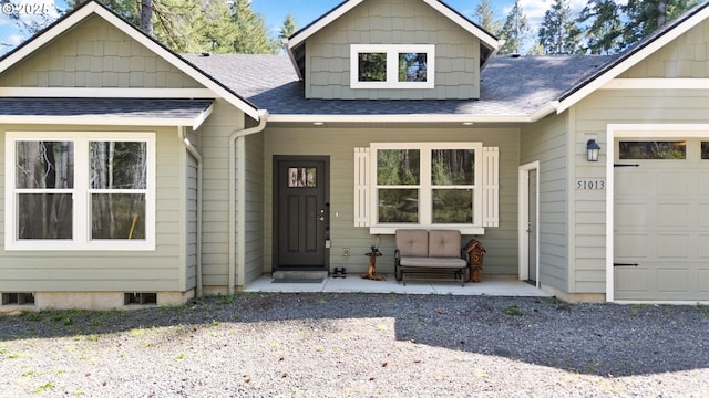 view of front of house featuring a porch and roof with shingles