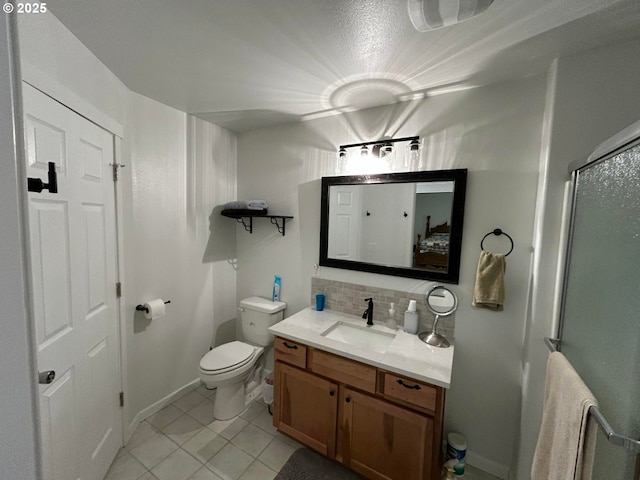 full bath with toilet, tile patterned floors, a shower stall, decorative backsplash, and vanity