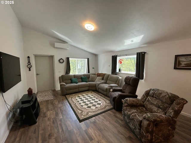 living area with lofted ceiling with skylight, a healthy amount of sunlight, a wall mounted AC, and wood finished floors