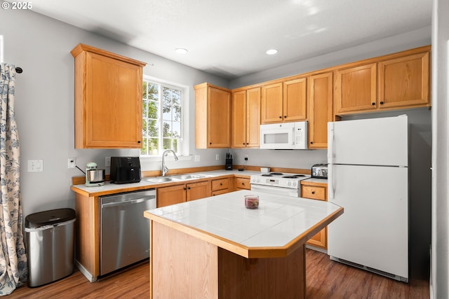 5908 SE 15th Dr, Gresham, OR 97080 - kitchen with white appliances, a sink, tile countertops, a center island, and wood finished floors