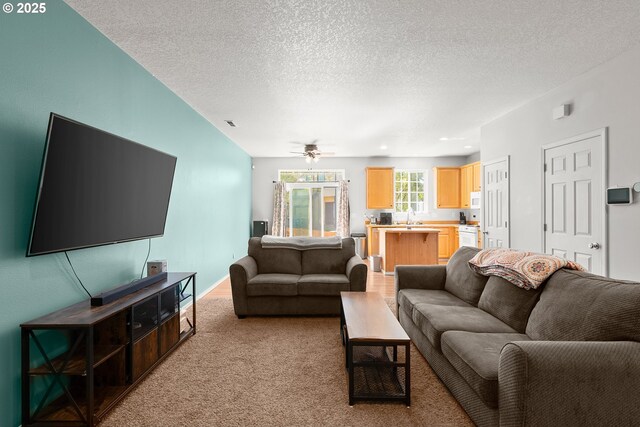 5908 SE 15th Dr, Gresham, OR 97080 - living room featuring light colored carpet, a textured ceiling, and a ceiling fan
