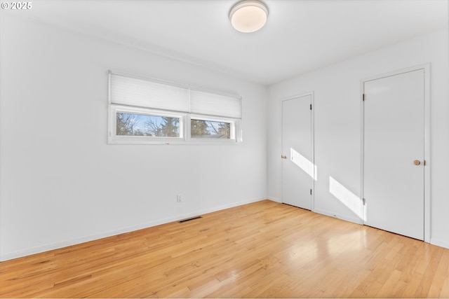 unfurnished bedroom with light hardwood / wood-style floors