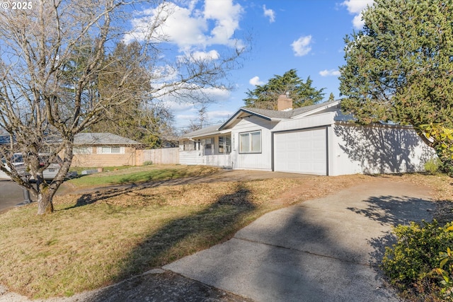 ranch-style house with a garage and a front yard