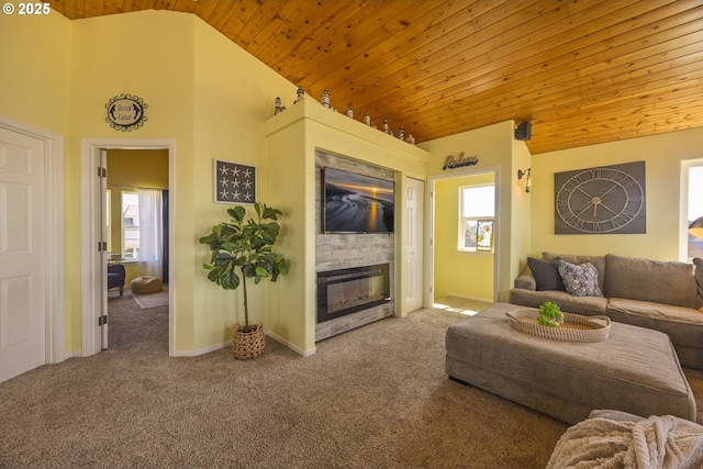962 SW Waziyata Ave, Waldport, OR 97394 - living room with wood ceiling, carpet floors, vaulted ceiling, and a glass covered fireplace
