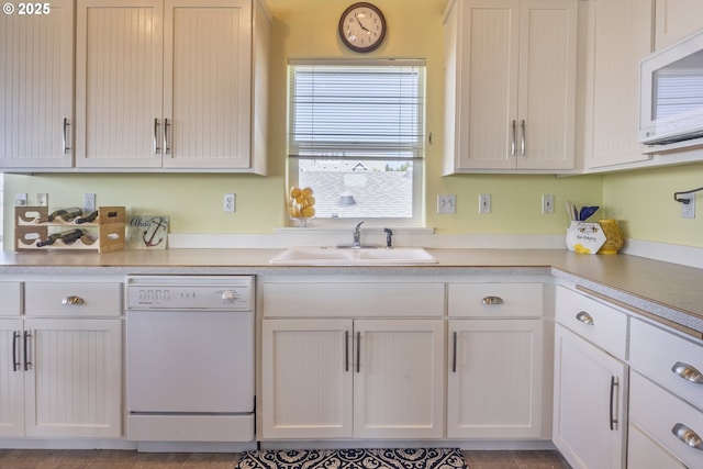 962 SW Waziyata Ave, Waldport, OR 97394 - kitchen featuring white appliances, light countertops, and white cabinetry