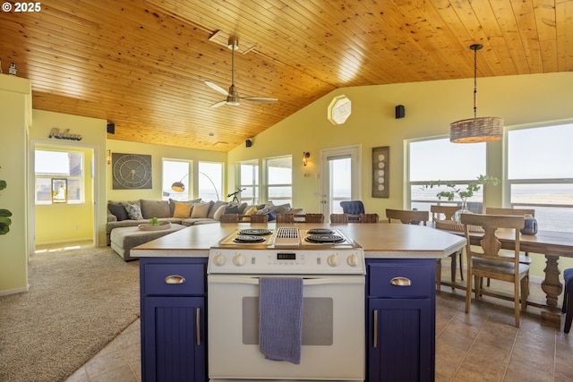 962 SW Waziyata Ave, Waldport, OR 97394 - kitchen with white range with electric cooktop, blue cabinets, open floor plan, plenty of natural light, and lofted ceiling