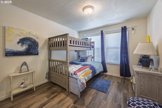 962 SW Waziyata Ave, Waldport, OR 97394 - bedroom featuring wood finished floors and a textured ceiling
