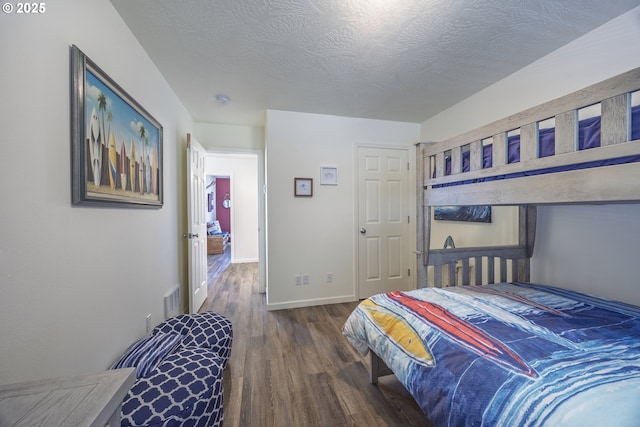 962 SW Waziyata Ave, Waldport, OR 97394 - bedroom featuring wood finished floors and a textured ceiling