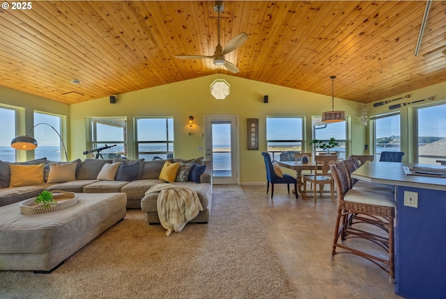962 SW Waziyata Ave, Waldport, OR 97394 - living area featuring lofted ceiling, wood ceiling, plenty of natural light, tile patterned floors, and ceiling fan