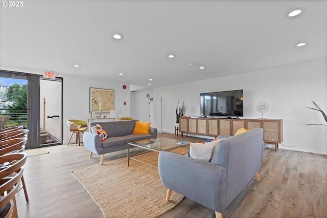 living area featuring recessed lighting and light wood-type flooring