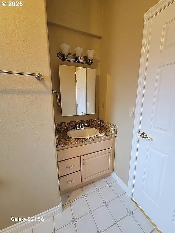 2525 Pine St, Seaside, OR 97138 - bathroom featuring vanity and baseboards