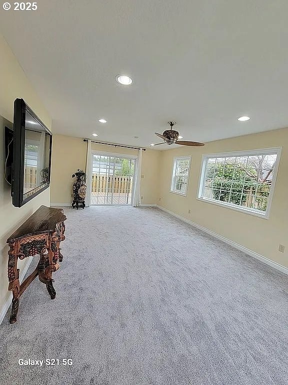 2525 Pine St, Seaside, OR 97138 - unfurnished living room with recessed lighting, baseboards, carpet floors, and a ceiling fan