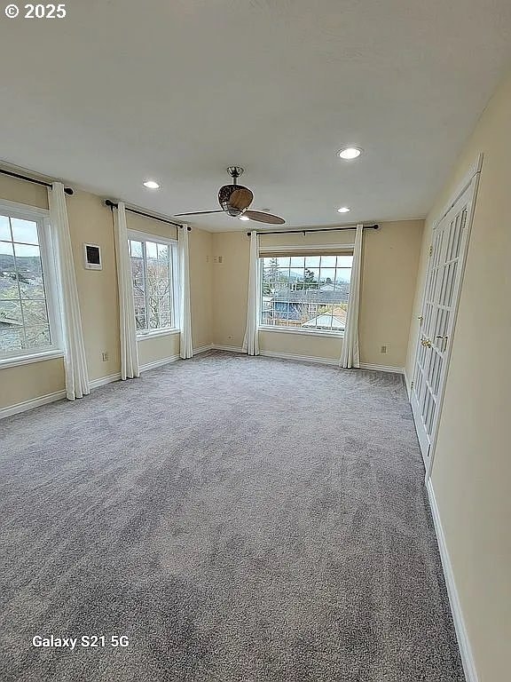 2525 Pine St, Seaside, OR 97138 - carpeted spare room with recessed lighting, baseboards, and plenty of natural light