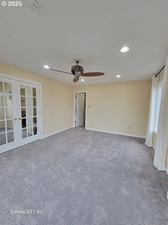 2525 Pine St, Seaside, OR 97138 - unfurnished room featuring ceiling fan, french doors, carpet, baseboards, and recessed lighting