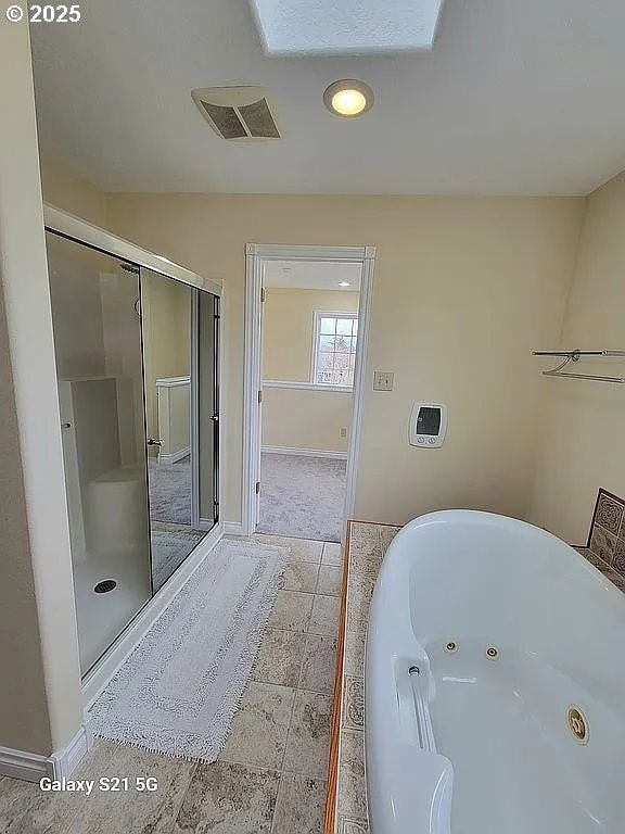 2525 Pine St, Seaside, OR 97138 - bathroom with a jetted tub, baseboards, a shower stall, and recessed lighting