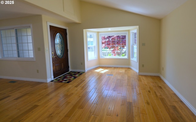 2525 Pine St, Seaside, OR 97138 - foyer featuring light wood-type flooring, baseboards, and lofted ceiling
