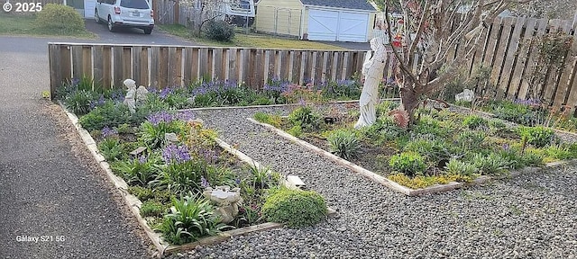 2525 Pine St, Seaside, OR 97138 - view of yard with a garden, fence, and an outdoor structure