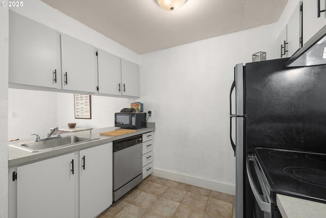 kitchen featuring range with electric cooktop, dishwasher, a sink, black microwave, and light countertops