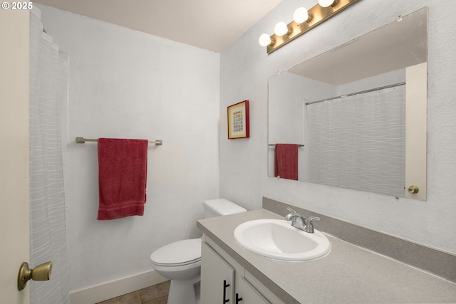 bathroom with toilet, curtained shower, baseboards, tile patterned flooring, and vanity