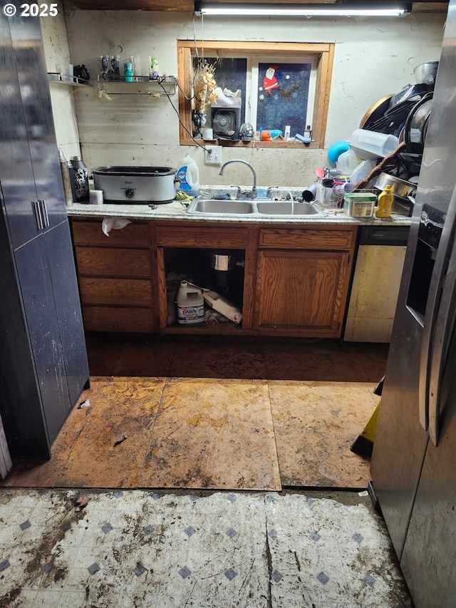 kitchen with sink and appliances with stainless steel finishes