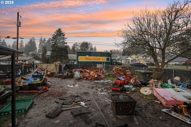 view of yard at dusk