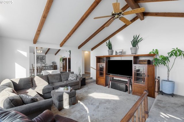 living area with a ceiling fan, light colored carpet, and vaulted ceiling with beams