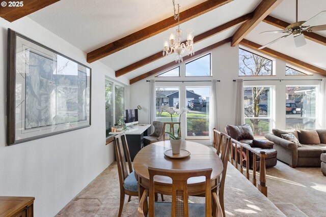 dining space featuring lofted ceiling with beams, light colored carpet, and an inviting chandelier