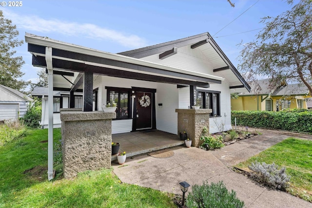 2479 Sherman Ave, North Bend, OR 97459 - view of front facade featuring a porch and a front lawn