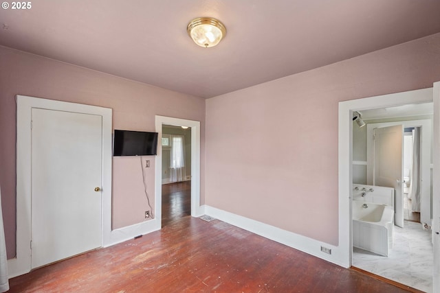 2479 Sherman Ave, North Bend, OR 97459 - unfurnished bedroom featuring wood finished floors and baseboards