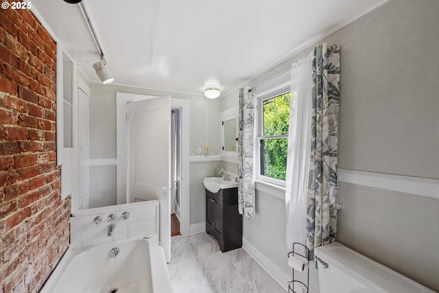 2479 Sherman Ave, North Bend, OR 97459 - bathroom featuring a bathtub, vanity, and marble look tile flooring