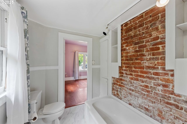 2479 Sherman Ave, North Bend, OR 97459 - full bathroom featuring marble look tile flooring, toilet, and a tub to relax in