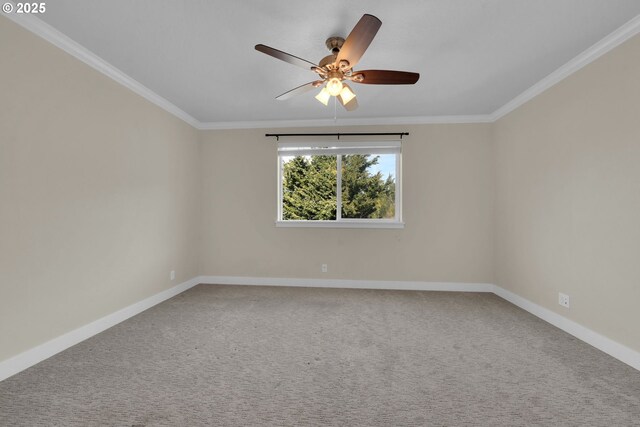 unfurnished room with baseboards, carpet floors, and crown molding