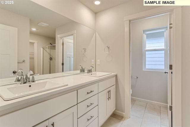 949 Legacy St, Eugene, OR 97402 - bathroom featuring a shower stall, double vanity, tile patterned floors, and recessed lighting
